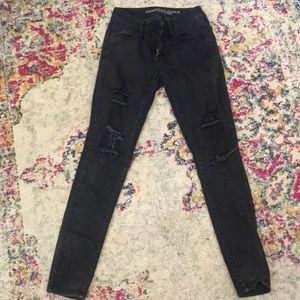 Black distressed skinny jeans by American Eagle